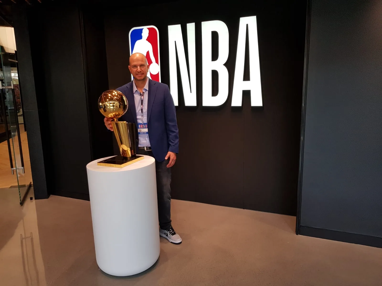 Tamir Kfir holding the NBA championship trophy
